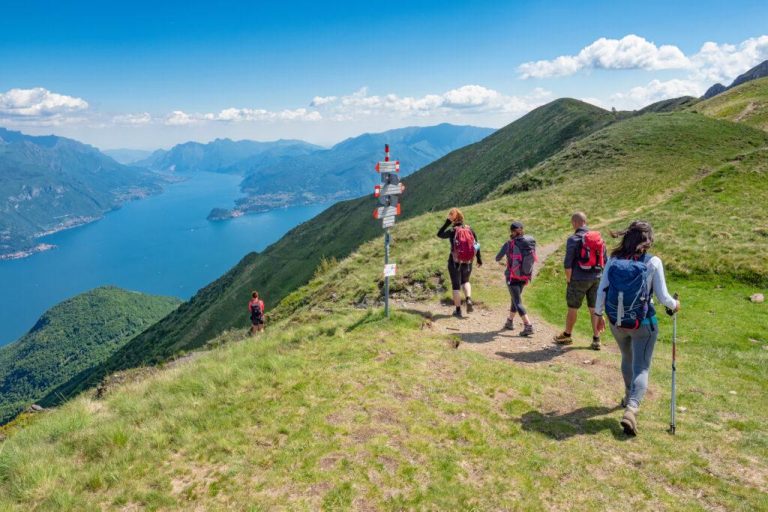 Trekking scene on Lake Como alps (the arrows indicates the names of the locations reached by the trails)