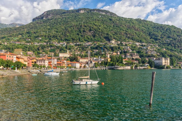 Town of Gravedona ed Uniti on Lake Como, waterfront with Palazzo Gallio, sail boats in foreground